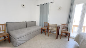 Double sofa bed with seating area and natural light in the Studio with Sofa Bed (4 Guests) at Argo Rooms Antiparos.